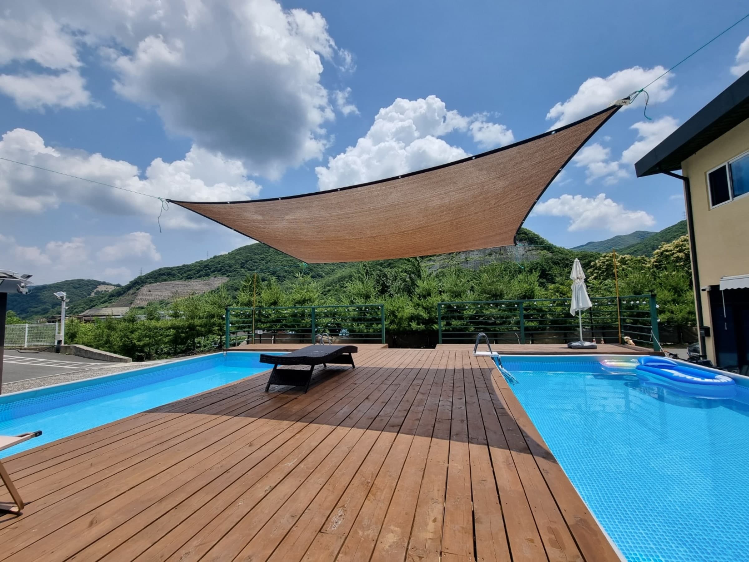 Outdoor terrace with hammock and mountain view